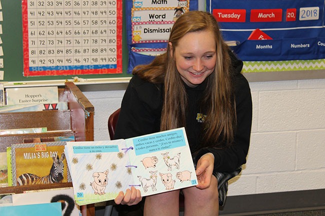 spanish class students read to elementary students